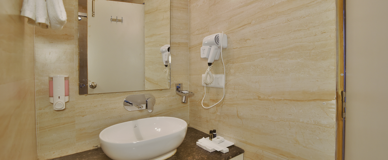 Vanity area of a washroom in the Premium Room at DLS Highland Resort and Spa, Mussoorie.